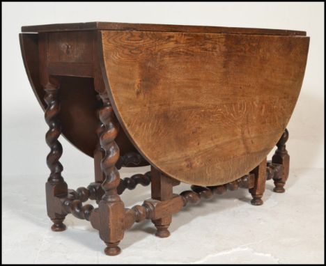 A good late 18th / 18th century barley twist large oak drop leaf / gate leg dining table together with a set of 6 oak and lea