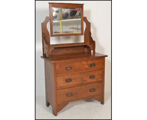 A Victorian arts &amp; crafts oak dressing chest ( table ) of drawers. Raised on bracket style feet having bank of drawers. F