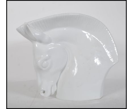 A large Royal Worcester Porcelain Art Deco style vase in the form of a stylised horse's head and neck with vase opening withi