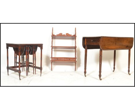 A 19th century mahogany pembroke dining table being raised on turned legs with end drawer and drop leaves either side. Togeth