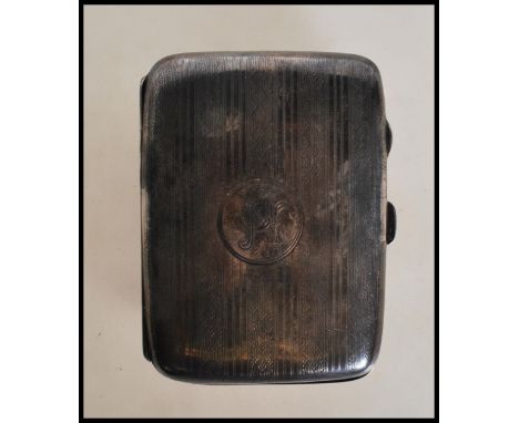 A silver hallmarked 1920's Art Deco vesta case having engine turned decoration to the exterior with a central round panel to 