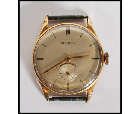 A vintage gentleman's Peerex antimagnetic wrist watch a round champagne dial having baton markings to the chapter ring and su