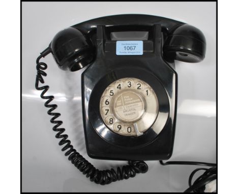 A vintage 1970's&nbsp; local interest black wall mounting dial telephone model 741 GNA 72/1 being converted to modern telepho