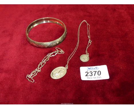 A sterling silver St Christopher, a delicate bracelet and an Indian silver bangle.