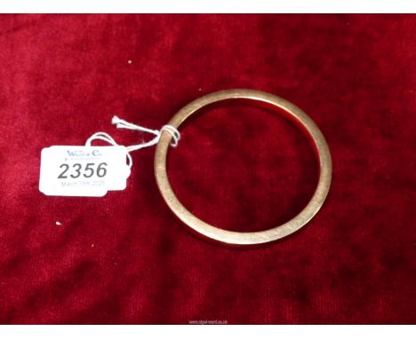 A 9ct gold bangle by Henry Griffiths & Son, 21.06 grams. (3 1/4" external diameter, internal diameter 3 1/4"),