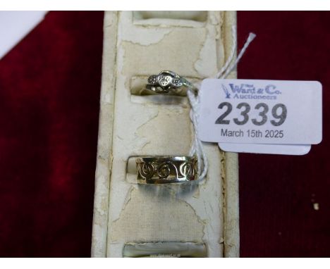A silver Celtic spiral wedding ring, maker D & W, 1996, 2.4 grams plus an Art Deco platinum and diamond trilogy set ring (ban