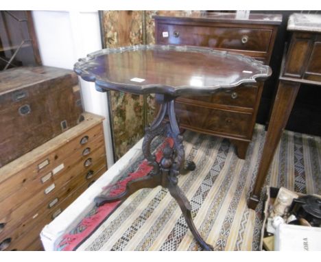 A mahogany occasional table on tripod base