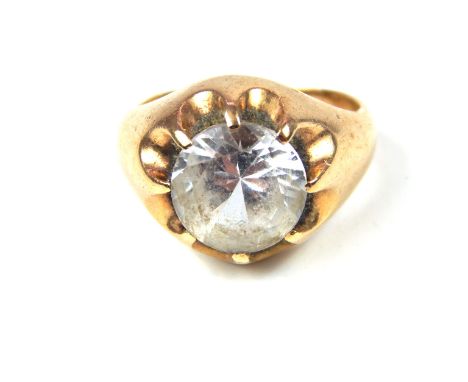 A vintage 9 ct yellow gold and crystal ring, the round, faceted crystal set into an eight clawed mount, with gently sloping s