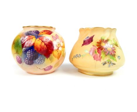 Two Royal Worcester blush ivory vases, one decorated with hand painted fruit and flowers, bearing puce mark to the underside,