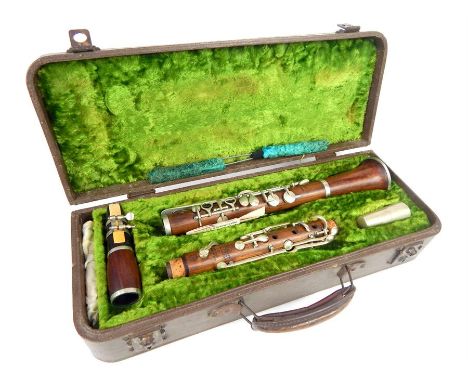 A mid 20th century E.J. Albert Brussels, simple system, wooden clarinet with fitted case and two cleaners; overall length 66.