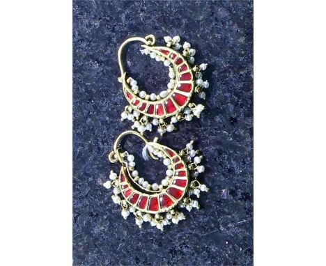 A pair of antique Indian hoop earrings, the crescent shaped bodies in high carat yellow gold, each set with thirteen irregula