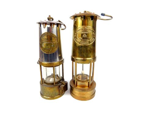 An E Thomas & Williams Ltd Welsh Cambrian brass miner's lamp, no 197153, 26 x 9 x 9cm, together with another miner's lamp by 