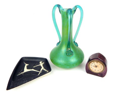 A mid 20thC Danish Soholm pottery dish depicting a man with a bow hunting two deer, 3 x 20 x 18.5cm, together with a purple r