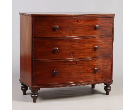 A Regency mahogany bow fronted three high chest of drawers raised on turned feet, 100cm wide. Condition Report. To be used as