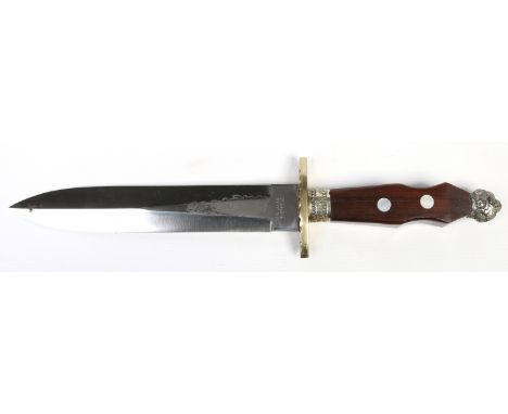 A double edge hunting knife by F. W. James of Sheffield. The blade having etched scrollwork decoration to both sides. With an