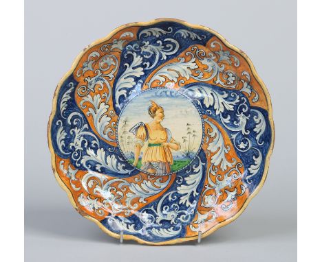 An 18th century Continental faience low tazza. With ground writhen bands alternating in cobalt blue and burnt orange framing 