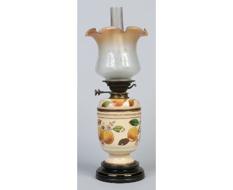 A 19th century Williams & Sons oil lamp decorated throughout with peach blossom on a stepped ebonized base, 58cm.