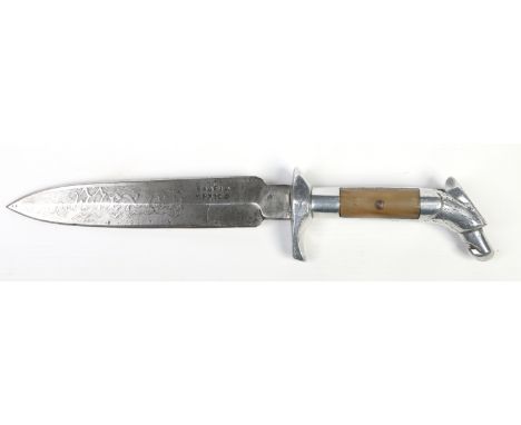 A double edged hunting knife. The blade etched Mexico to one side and with a crescent moon decoration to the other. With a wh