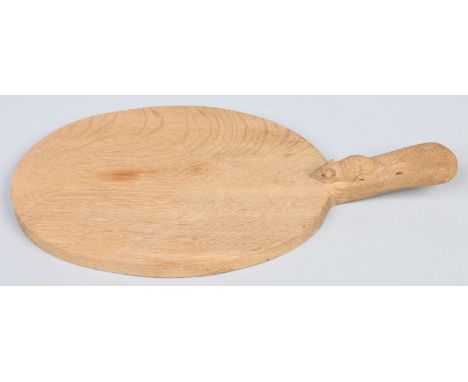 A Robert "Mouseman" Thompson oak cheese board of oval form and with carved Mouseman device to the handle, 40cm. Condition Rep