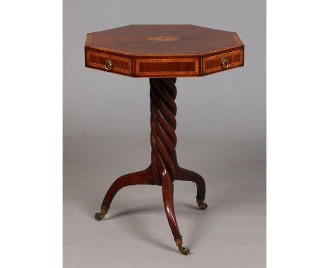 A Regency mahogany centre pedestal octagonal drum table. Inlaid to the centre with a fan patera issuing strung segments frame