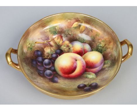A china twin handled fruit bowl painted by Royal Worcester artist F. R. Budd with grapes and pears and with gilt ground exter