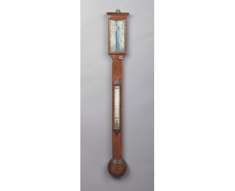 A Victorian oak cased stick barometer with ivory dials, 92cm. Condition Report. To be used as a guide only. Adjusters working