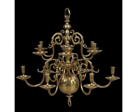 An 18th century style brass Flemish 12 branch chandelier, with detachable double scrolling candle branches affixing to the ce