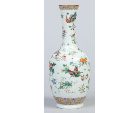 A Chinese bottle vase painted in coloured enamels with butterflies and scattered sprigs. Underglaze Qianlong square seal mark