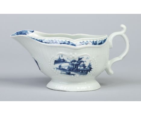 A Worcester strap moulded sauceboat. Painted in underglaze blue with the sinking boat fisherman pattern. Workman's mark c1755