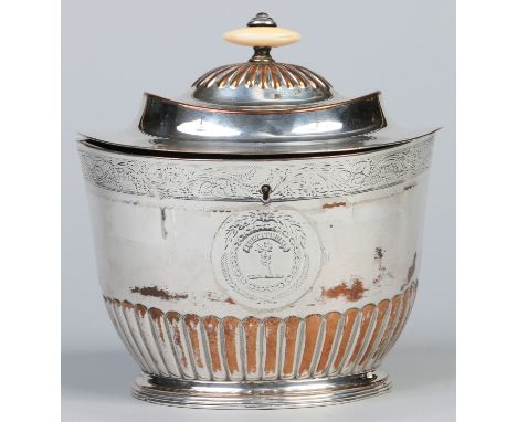 An Old Sheffield Plate tea caddy of ovoid partially fluted form. With ivory finial and stepped hinged cover housing two compa