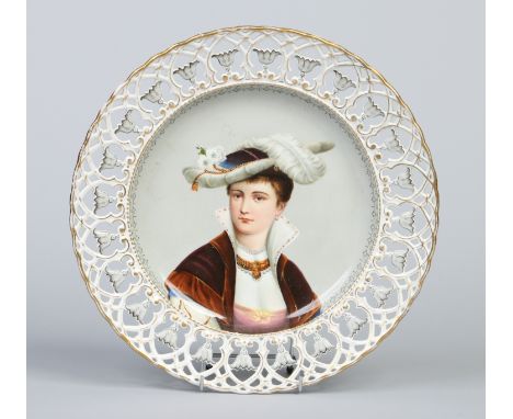 A Bavarian porcelain charger with pierced border edged in gilt and grey enamel. Painted to the centre with the portrait of a 