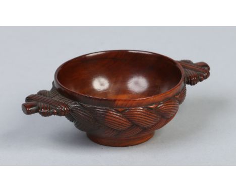 A Scottish treen quaich carved to the exterior with Celtic knots, 10cm wide.  Condition Report. To be used as a guide only. G