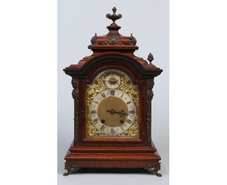 A 19th century German mahogany cased bracket clock. With gilt brass arch top dial having slow / fast subsidiary and silvered 