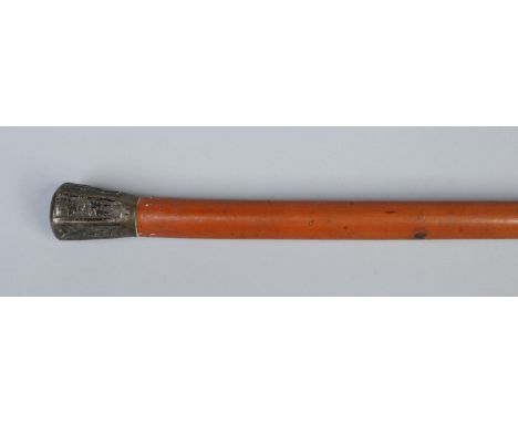 A Chinese malacca walking cane with white metal top. Chased with  alternating panels of flowers and characters. Punch mark K.