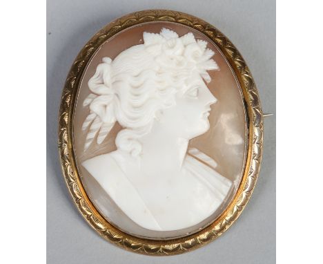 A Victorian yellow metal shell cameo brooch, profile portrait of a young woman, 5cm. Condition Report. To be used as a guide 