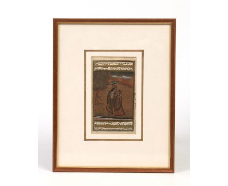 A gilt framed antique Persian manuscript page showing both sides. With gouache illustration depicting a courting couple and w