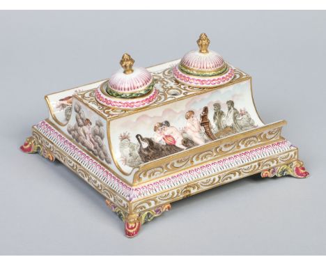 A Capodimonte desk stand incorporating a pair of inkwells with domed covers and flame finials. Moulded and decorated in colou