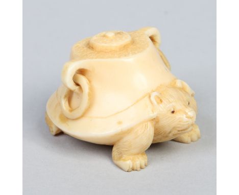 A Japanese carved ivory netsuke formed as a cat under a vessel posing as a tortoise, signed 5cm. Condition Report. To be used