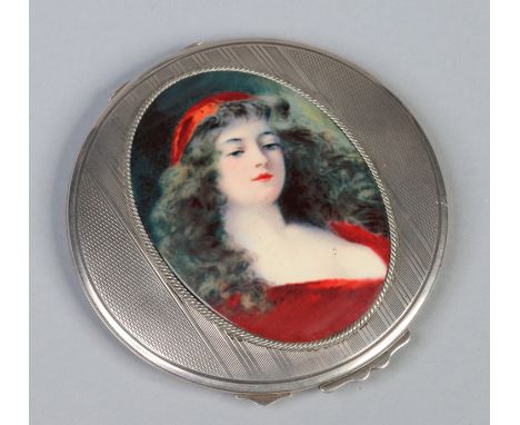 A George VI ladies silver powder compact with engraved decoration and later applied ovoid enamel plaque with a portrait of a 