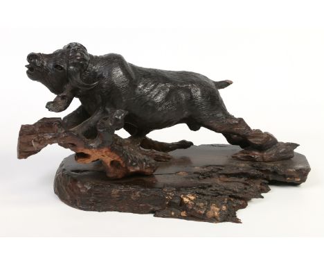 A Chinese carved hardwood model of a water buffalo, 50cm.  Condition Report. To be used as a guide only. Some losses. 