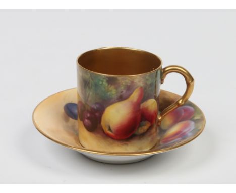 A Royal Worcester coffee can and saucer. With faux bamboo moulded handle and painted with fruit. The cup by George Moseley an