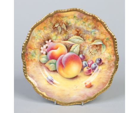 A Royal Worcester cabinet plate with gardrooned gilt border. Painted by P. English with peaches and cherries. Signed, printed