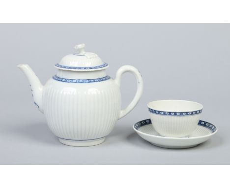 A Worcester tightly fluted teapot and cover and similar tea bowl and saucer. Each painted in underglaze blue with cell border