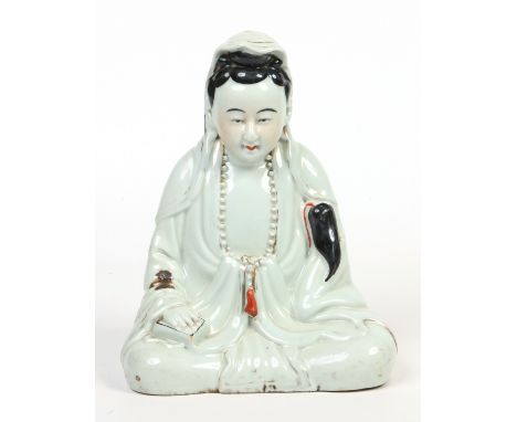 A Chinese model of a seated female Buddha. Left mainly in the white with restrained enamels, 27cm. Condition Report. To be us