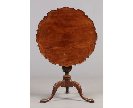 A Georgian mahogany centre pedestal snap top table. With dished and scalloped top raised on a fluted column with wrythen moul