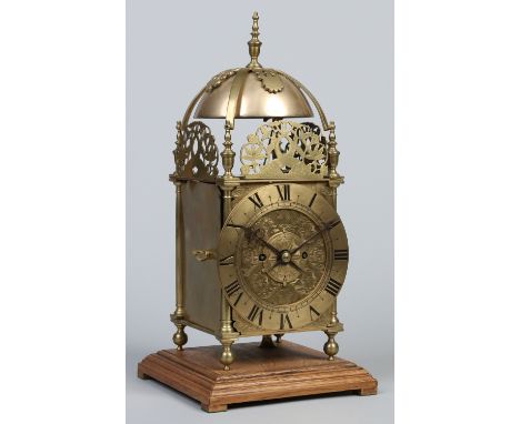 A late 19th / early 20th century brass lantern clock of large proportions. Housing a double fusee movement striking quarterly