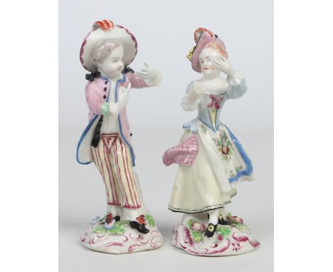 A pair of Bow figures modelled as new dancers. Decorated in coloured enamels, the boy wearing a pink frock coat and stripped 