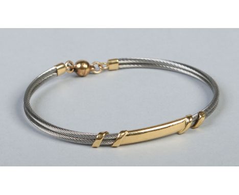 An Austrian 18 carat gold mounted wire bangle with magnetized clasp. Condition Report. To be used as a guide only. Good condi