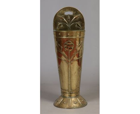 An Art Nouveau hammered brass stick stand of tapering form and decorated with stylized flowers, 105cm. Condition Report. To b