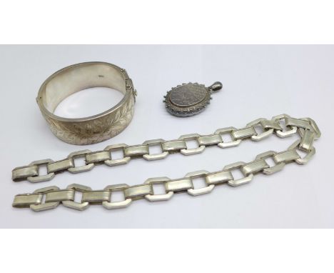 A silver bangle, locket and collar (collar with no fasteners) 